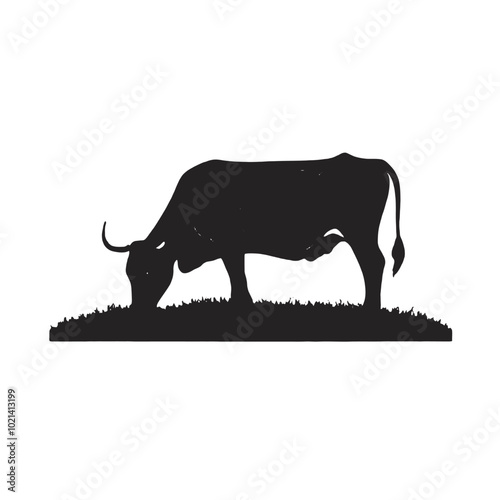 A black silhouette of a cow grazing in a grassy field