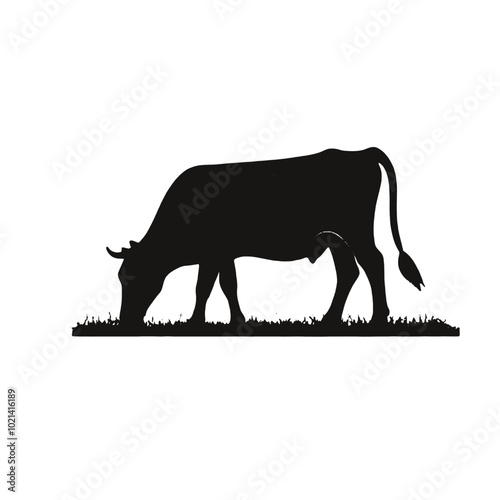 A black silhouette of a cow grazing in a grassy field