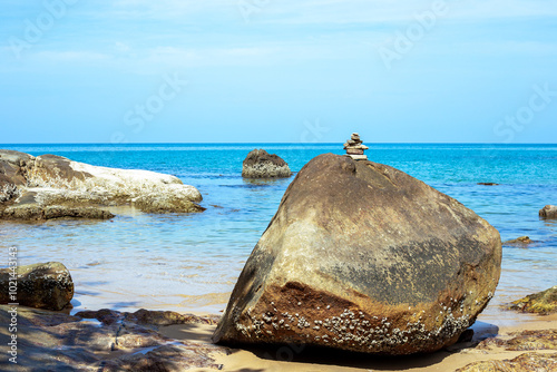 seascape. Blue sea and boulder on the shore. Rocky shore