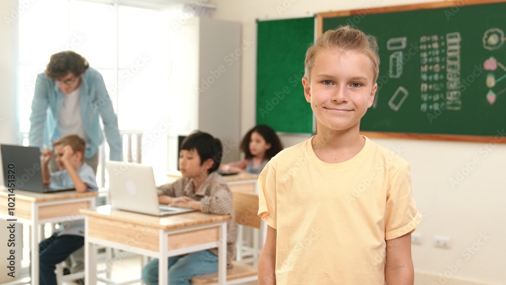 Fototapeta premium Caucasian cute student looking at camera while friend studying about writing engineering code or coding prompt. Professional smart teacher checking prompt while teaching about AI generated. Pedagogy.