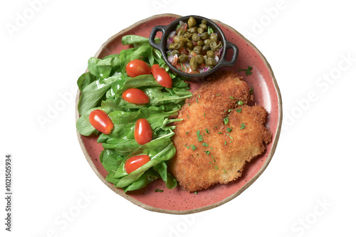 plate of food with chicken breast salad and caper sauce fish and chicken fillet photo