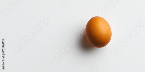 Minimalist Golden Egg on Soft Grey Background