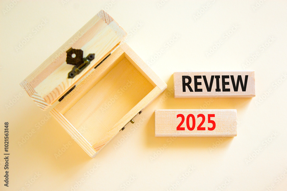 Planning review 2025 new year symbol. Concept words Review 2025 on beautiful wooden blocks. Beautiful white background. Wooden empty chest. Business review 2025 new year concept. Copy space.