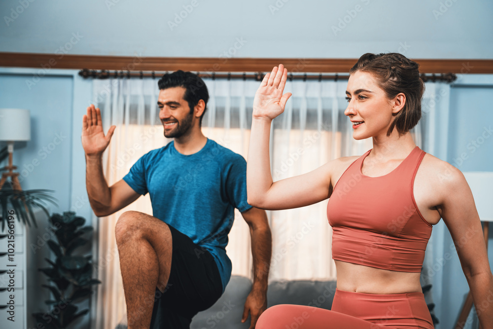 Athletic and sporty fitness couple or exercise buddy running posture at home body workout exercise session for fit physique and healthy sport lifestyle at home. Gaiety home exercise workout training. Athletic and sporty fitness couple or exercise buddy running posture at home body workout exercise session for fit physique and healthy sport lifestyle at home. Gaiety home exercise workout training.