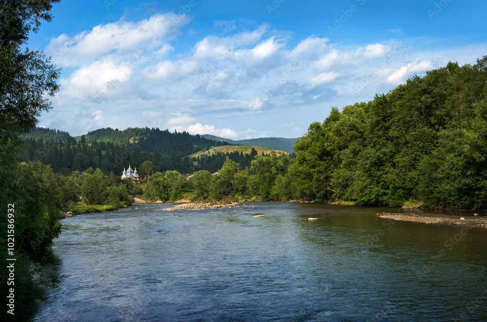 The Iltsy river flows into the Black Cheremosh and the church in the village of Iltsi, Verkhovyna, Ukraine The Iltsy river flows into the Black Cheremosh and the church in the village of Iltsi, Verkhovyna, Ukraine
