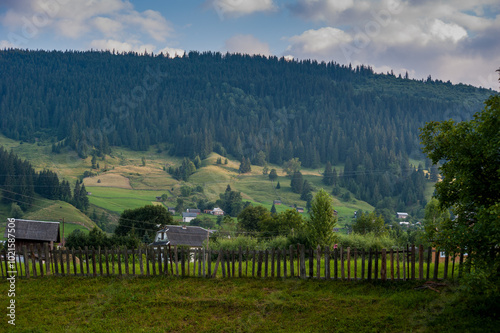 Hutsul courtyards, buildings in the Carpathians landscape.