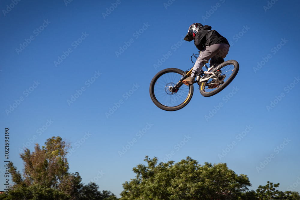 Mountain Biker Soaring Mid-Air, BMX Freestyle Jump, Extreme Sports, Outdoor Adventure, Adrenaline Action, High-Altitude Trick, Off-Road Cycling, Dirt Jumping, Outdoor Challenge, Thrilling Performance Mountain Biker Soaring Mid-Air, BMX Freestyle Jump, Extreme Sports, Outdoor Adventure, Adrenaline Action, High-Altitude Trick, Off-Road Cycling, Dirt Jumping, Outdoor Challenge, Thrilling Performance