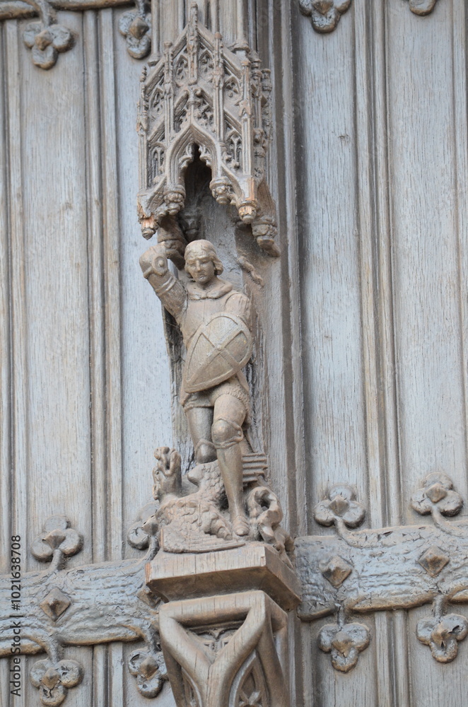 Intricate Wooden Sculpture of a Knight on a Gothic Door in Brussels
Intricate Wooden Sculpture of a Knight on a Gothic Door in Brussels