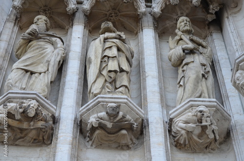 Detailed Stone Sculptures of Apostles on a Gothic Cathedral Facade in Brussels 