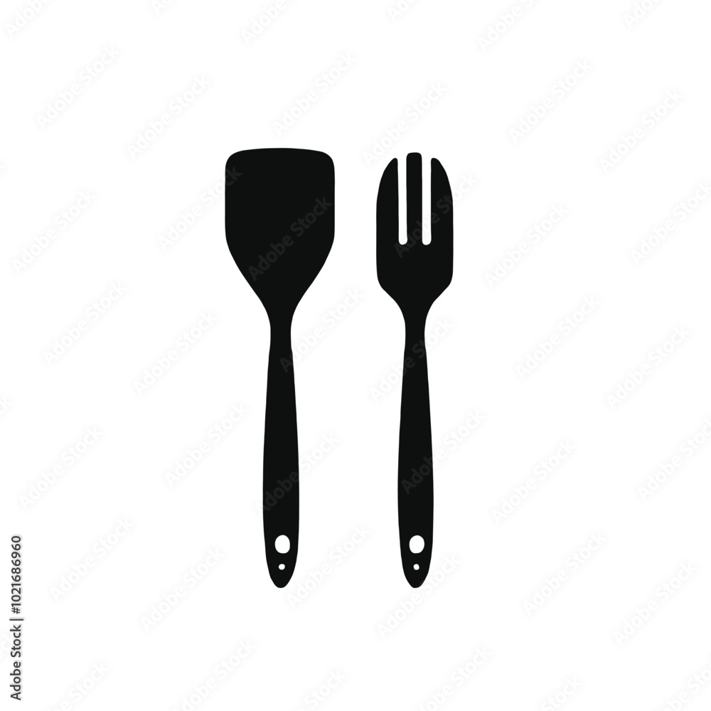 Two black kitchen utensils, a spatula and a slotted spoon, on a white background Two black kitchen utensils, a spatula and a slotted spoon, on a white background