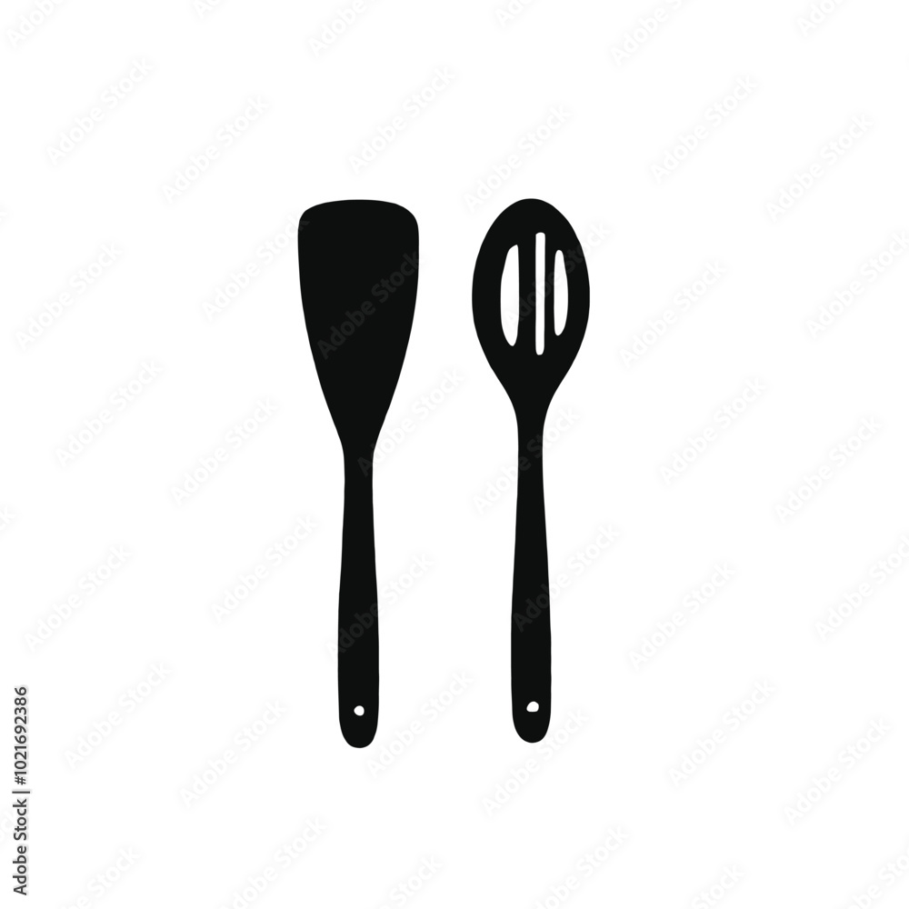 Two black kitchen utensils, a spatula and a slotted spoon, on a white background Two black kitchen utensils, a spatula and a slotted spoon, on a white background