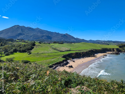 La Beciella beach and Sierra del Sueve in background, Colunga municipality, Asturias, Spain photo