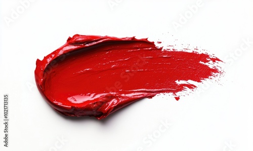 A red lipstick smear is shown on a white background photo