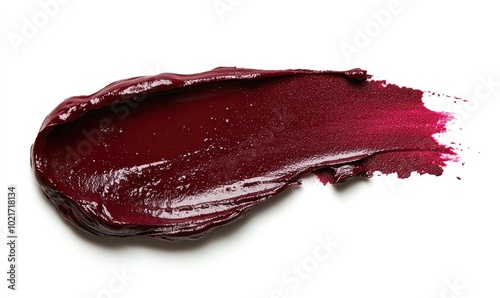 A red lipstick stain on a white background