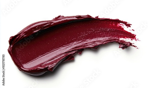 A red lipstick stain on a white background