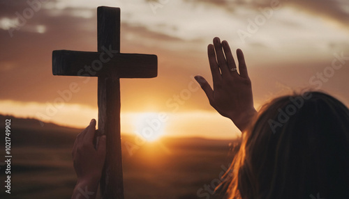 Woman Praying With Cross at Sunset