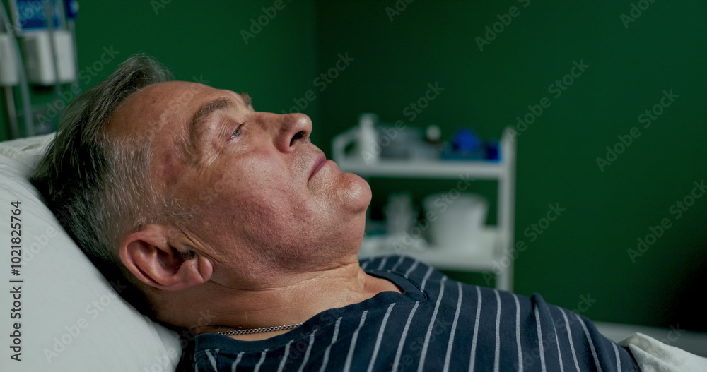 Obraz premium Close up shot on exhausted tired patient on bed in hospital ward doctor put on oxygen mask on man in bed .