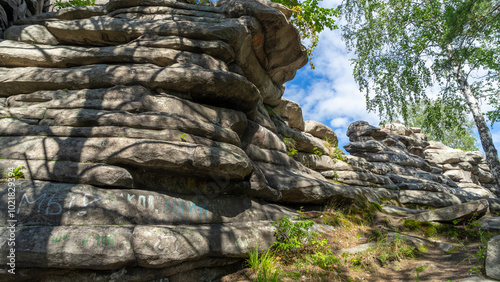 Devil's Hillfort complex on sunny summer day. Iset Park, Iset village, Sverdlovsk region, Russia. Hiking and walking