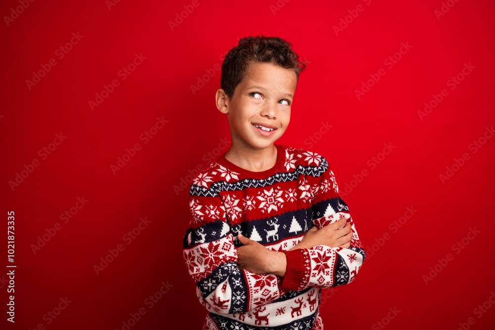 Photo portrait of cute little boy crossed hands look empty space celebrate christmas wear knitwear sweater isolated on red color background Photo portrait of cute little boy crossed hands look empty space celebrate christmas wear knitwear sweater isolated on red color background