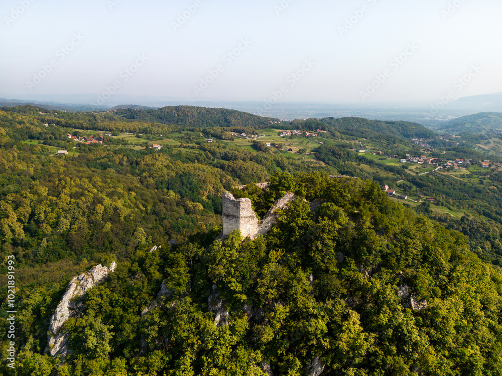 Drone view of ruins of old, once fortified keep on the top of Okic hill, ovelooking the valley, near town of Samobor, Croatia Drone view of ruins of old, once fortified keep on the top of Okic hill, ovelooking the valley, near town of Samobor, Croatia