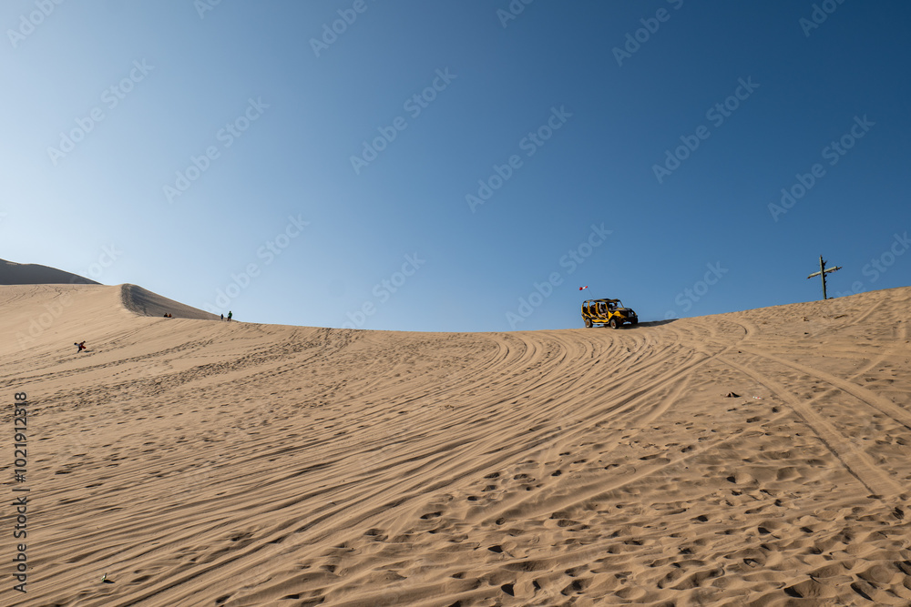 Oasis in the Middle of Large Desert Dunes Known as Huacachina in Ica, Peru at Sunset