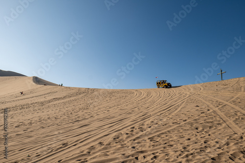 Obraz na płótnie Oasis in the Middle of Large Desert Dunes Known as Huacachina in Ica, Peru at Sunset w salonie