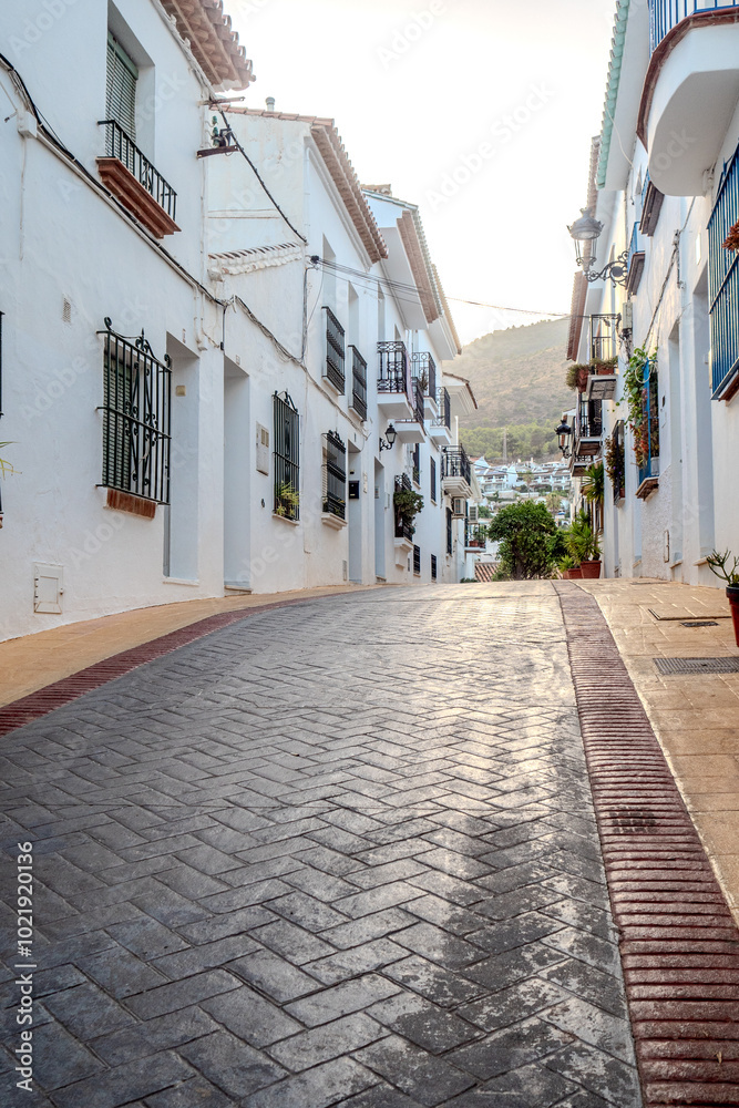 Obraz premium benalmadena old village architecture details during dusk hour, street view