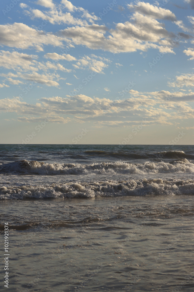 Sea view from the shore. Horizon on the sea. Balearic Sea, Salou, Spain. View of large waves on the sea from a low angle. Landscape. Stormy weather Sea view from the shore. Horizon on the sea. Balearic Sea, Salou, Spain. View of large waves on the sea from a low angle. Landscape. Stormy weather