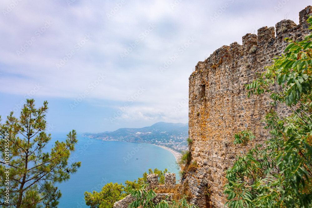 Landscape view old walls of fortress on Mediterranean coast. View of Alanya Castle, stone ruins in harbor Alanya, Turkey. High quality photo