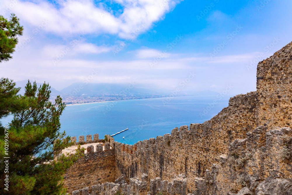 Landscape view old walls of fortress on Mediterranean coast. View of Alanya Castle, stone ruins in harbor Alanya, Turkey. High quality photo Landscape view old walls of fortress on Mediterranean coast. View of Alanya Castle, stone ruins in harbor Alanya, Turkey. High quality photo