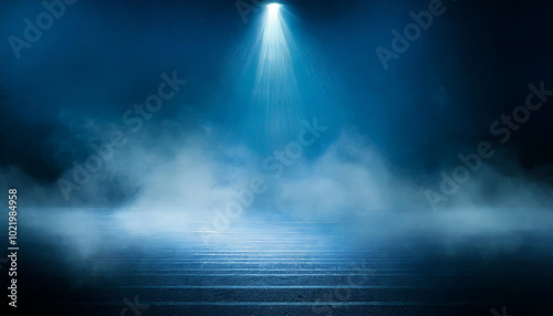 Mysterious blue mist illuminated by a single spotlight in a dark environment creating an atmospheric effect