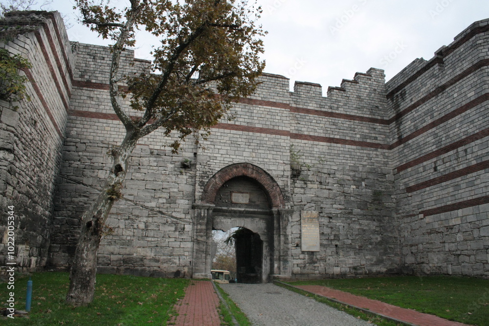 Ancient Byzantine Fortress Gate with Stone Walls and Battlements Ancient Byzantine Fortress Gate with Stone Walls and Battlements