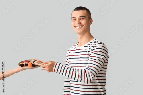 Young man and hand holding ...