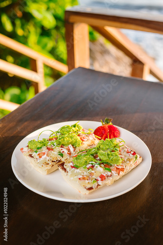 mexican mollete sandwich with beans and white cheese photo