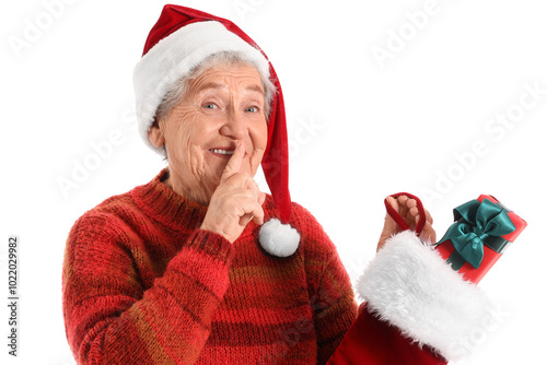 Senior woman in Santa hat w...