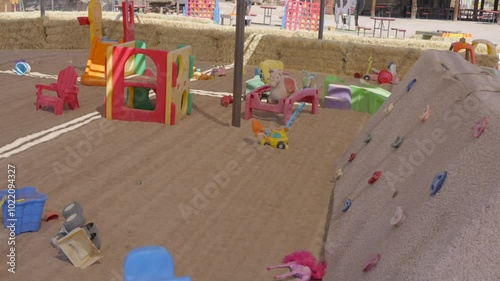 Wallpaper Mural This panning video shows a sandy outdoor playground filled with children's outdoor toys. Torontodigital.ca
