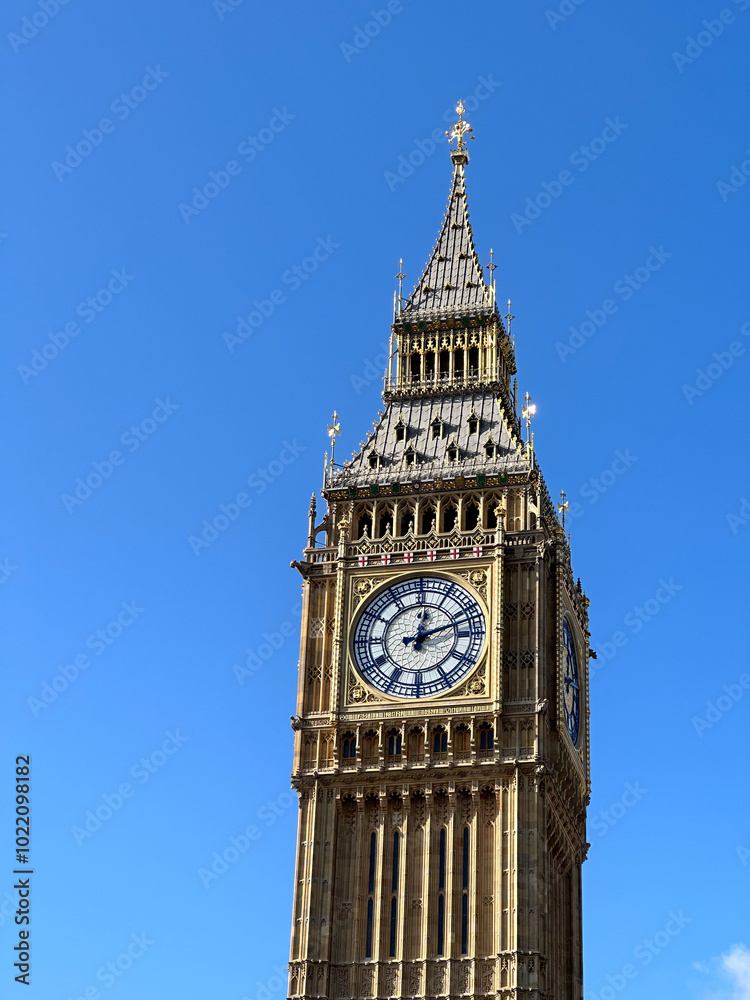 Iconic Big Ben Clock Tower Against a Clear Blue Sky Iconic Big Ben Clock Tower Against a Clear Blue Sky