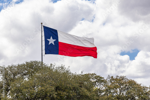 The Texas state flag blowing in the wind. photo