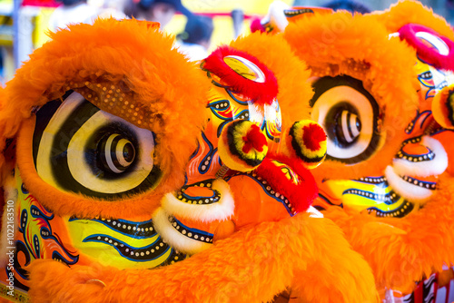 a traditional lion dance at a temple festival. photo