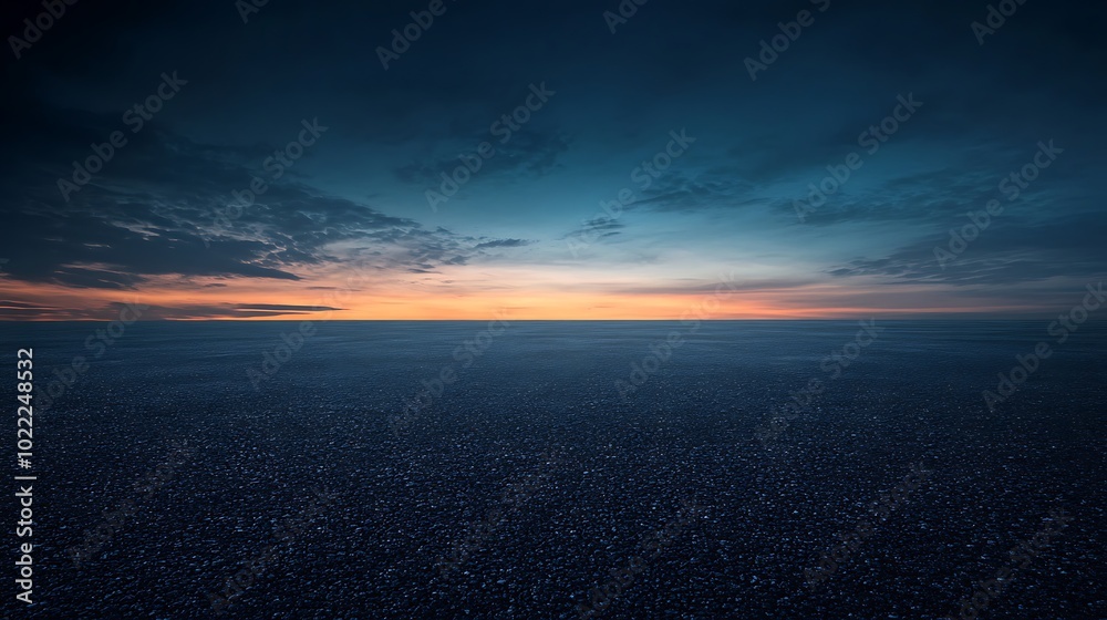 Fototapeta premium Asphalt Road Under a Dramatic Sunset Sky