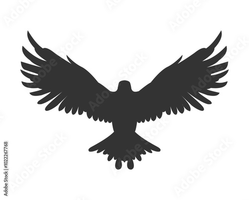 silhouette of eagle flapping wings