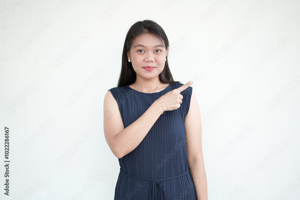 Beautiful Asian Woman wearing formal dress pointing side of copy space, promotion and recommendation concept Isolated On White Background Beautiful Asian Woman wearing formal dress pointing side of copy space, promotion and recommendation concept Isolated On White Background