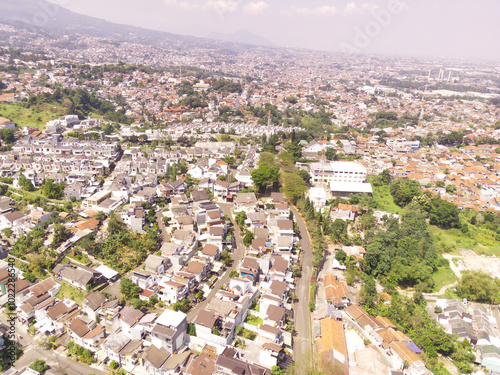 Picturesque landscape of townscape in Bandung, Indonesia. Urban skyline of the densely populated City in South East Asia. Bandung City is inhabited by 2.5 Million People. Aerial Photography