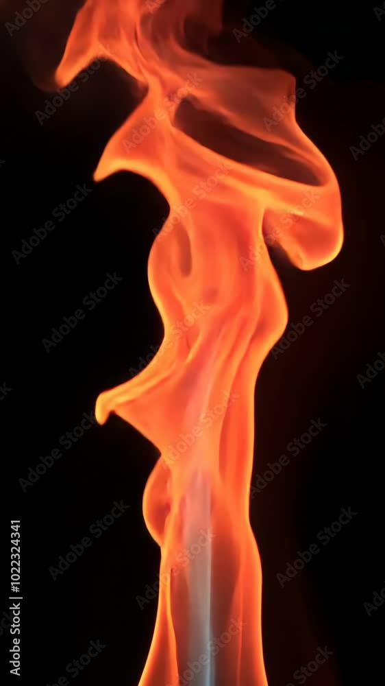 Flames dancing on a black background, abstract art. Energy and movement concept Flames dancing on a black background, abstract art. Energy and movement concept