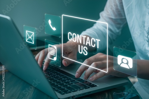 Closeup of person s hands typing on laptop with contact us interface
