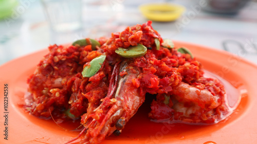 Balado udang Petai, traditional food made from petai, pete with Shrimp, cooked with mashed red chili. close up view photo