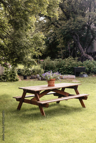 A wooden picnic table set up outdoors 