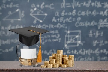 Student Success and education investment concept, coins and books