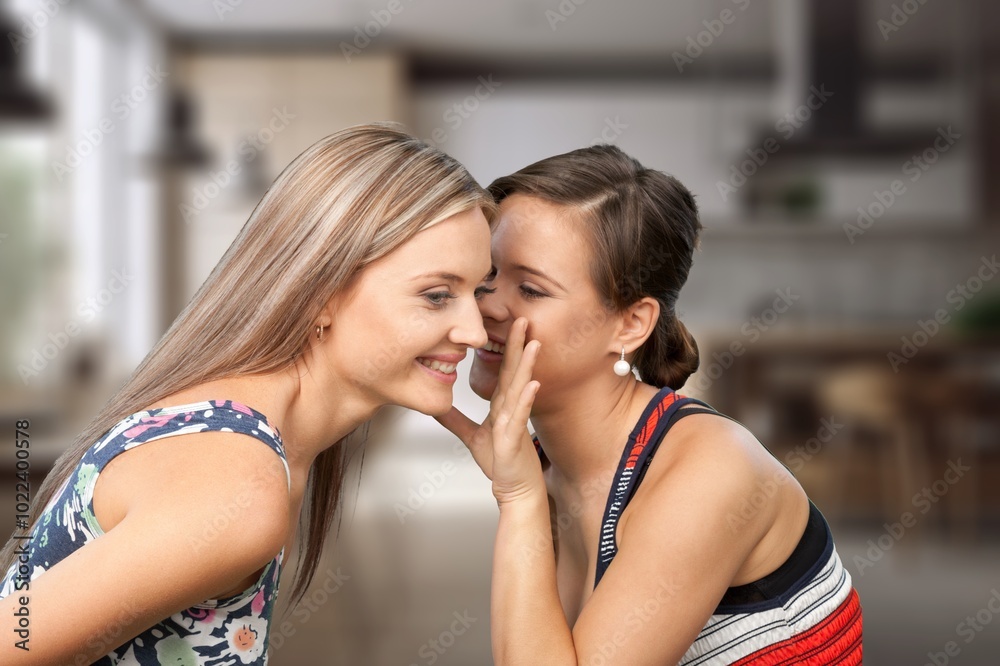 Loving mother with adult teen daughter together at home