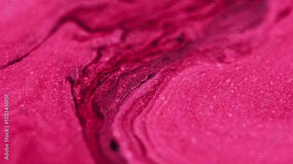 Ink emulsion. Glitter flow. Glowing texture crimson pink red black mix pigment sparkling particles motion hypnotical abstract art background.